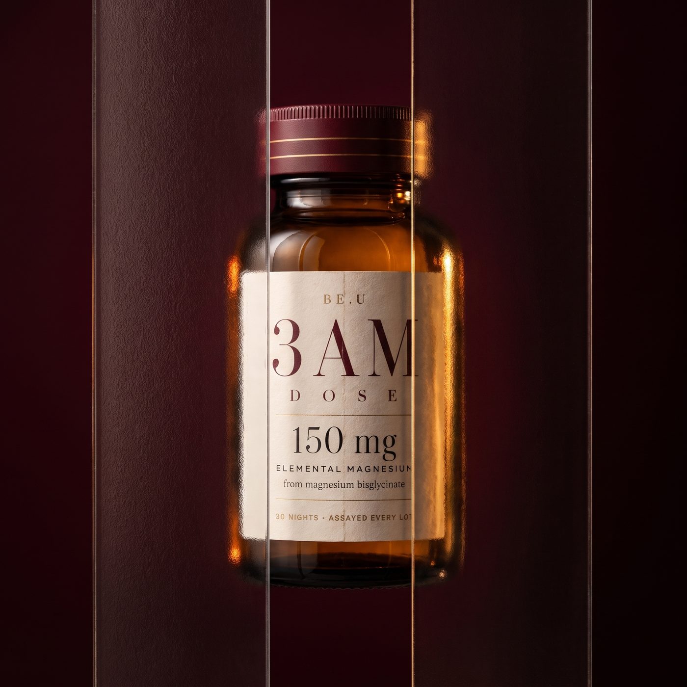A bottle of 3AM Drops in low bordeaux light